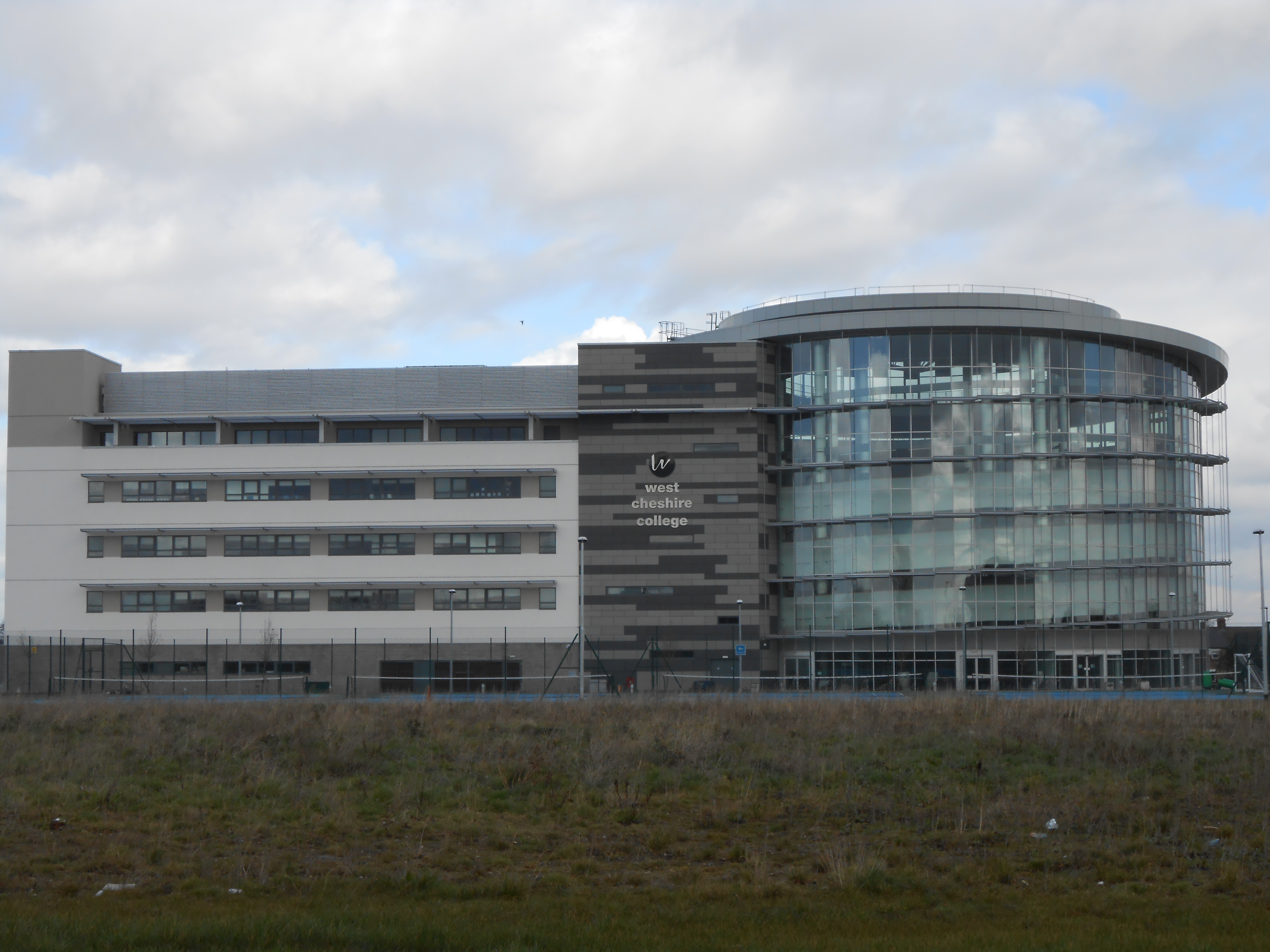 Ellesmere Port college building with a curved glass frontage, photographed in 2014